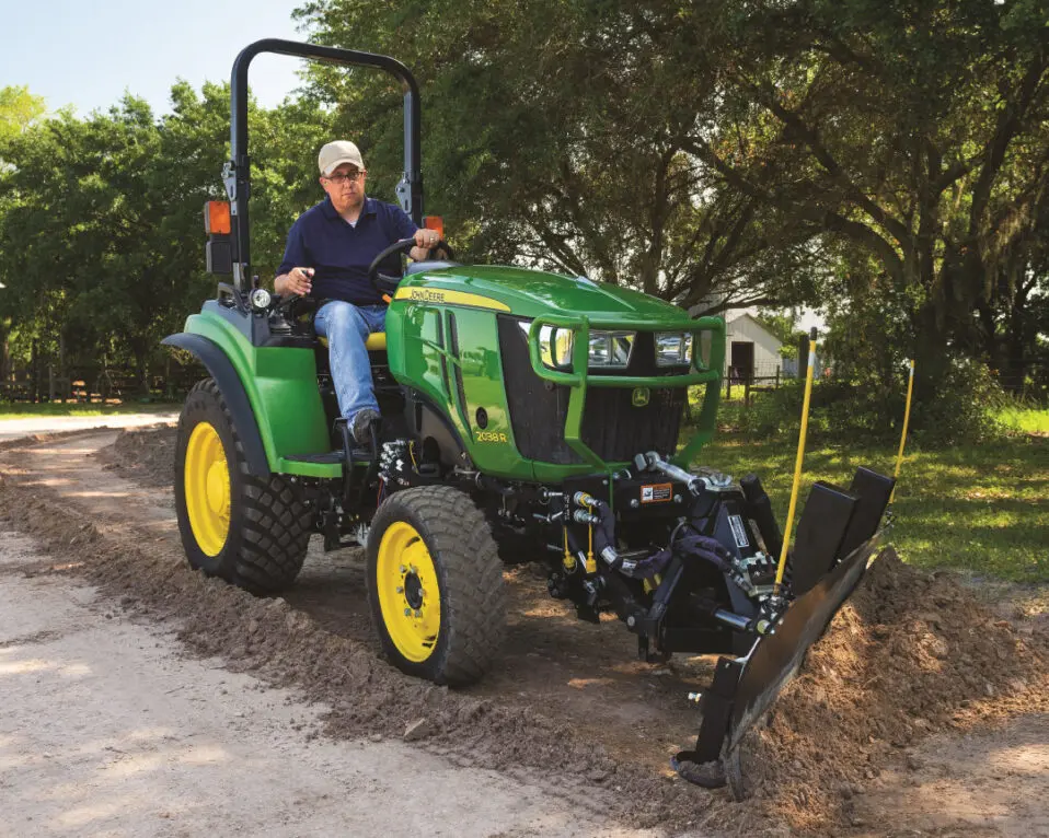 Man driving 2038R Compact Tractor