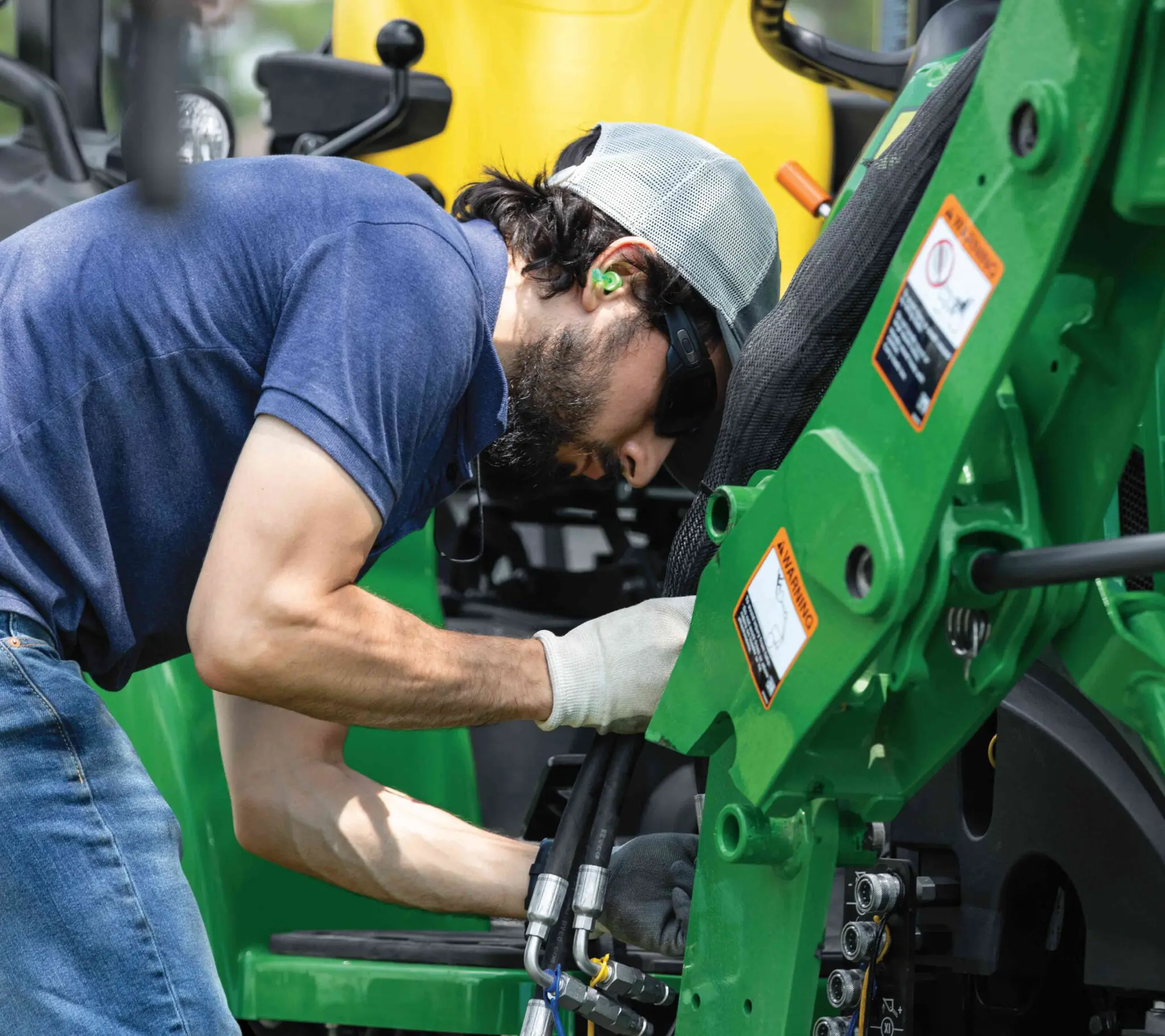 Diagnosing John Deere equipment with repair tools and service resources