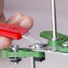 Image of a person using the included tools to build the John Deere 9RT Series Erector buildable toy tractor.