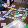 Image of a family playing John Deere-Opoly.