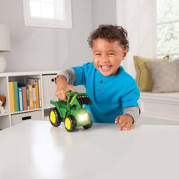 Image of a child playing with the John Deere roll n go children's toy flashlight