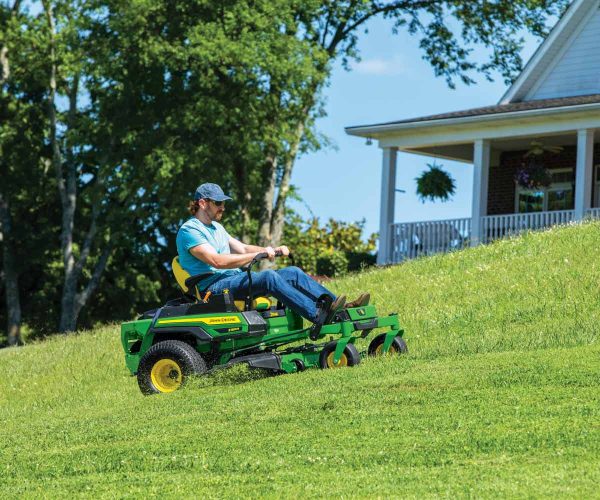 Image of man mowing with a John Deere Z330R zero turn lawn mower