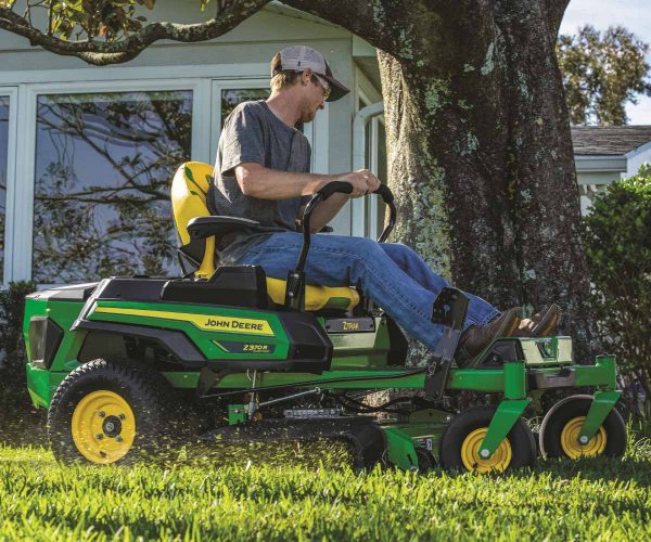 Image of a person mowing their grass on the John Deere Z370R Electric ZTrak Zero Turn lawn mower.