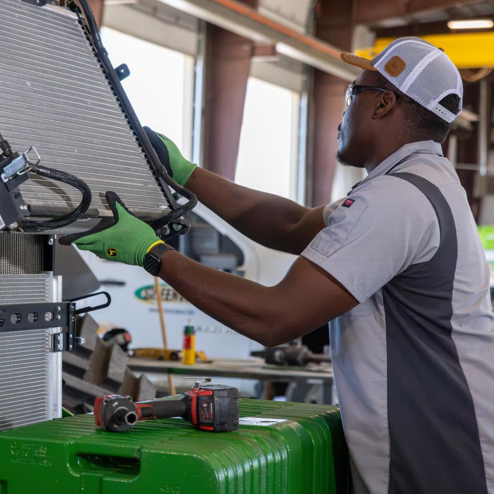 Image of Service Technician working on equipment